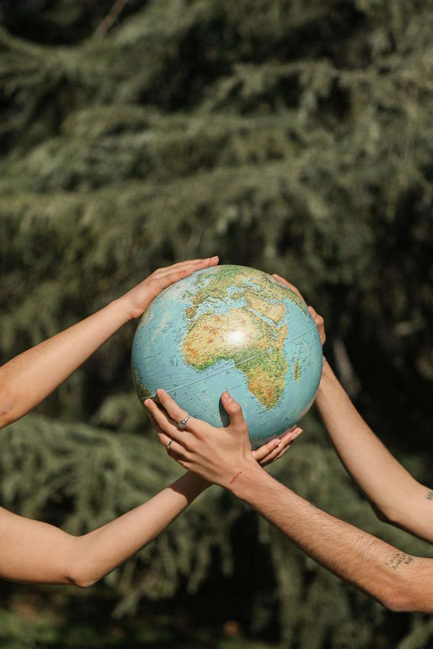 people holding a globe