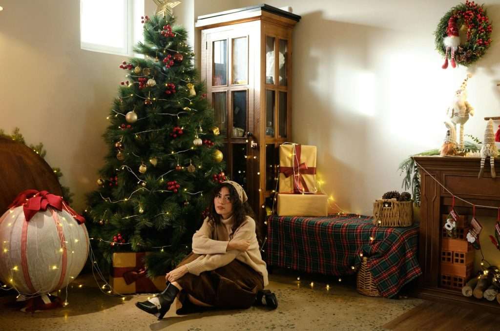 cozy christmas corner with woman and decorations